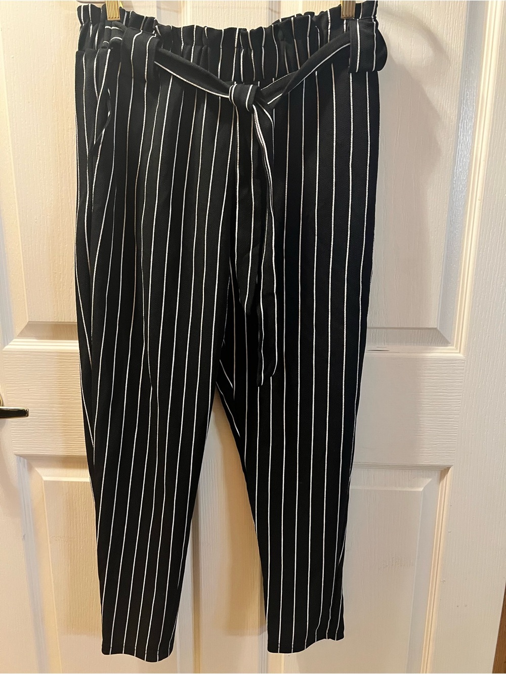 Black Pants with White Stripes.